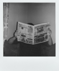 grayscale photography of man reading newspaper 2146358